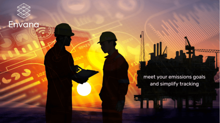 Two workers against an offshore oil platform
