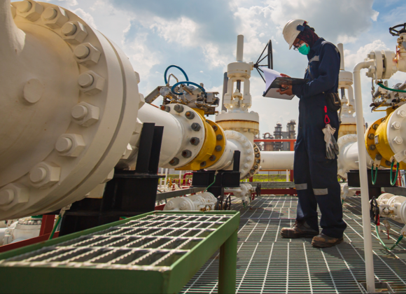 Engineer reviewing emissions tracking data